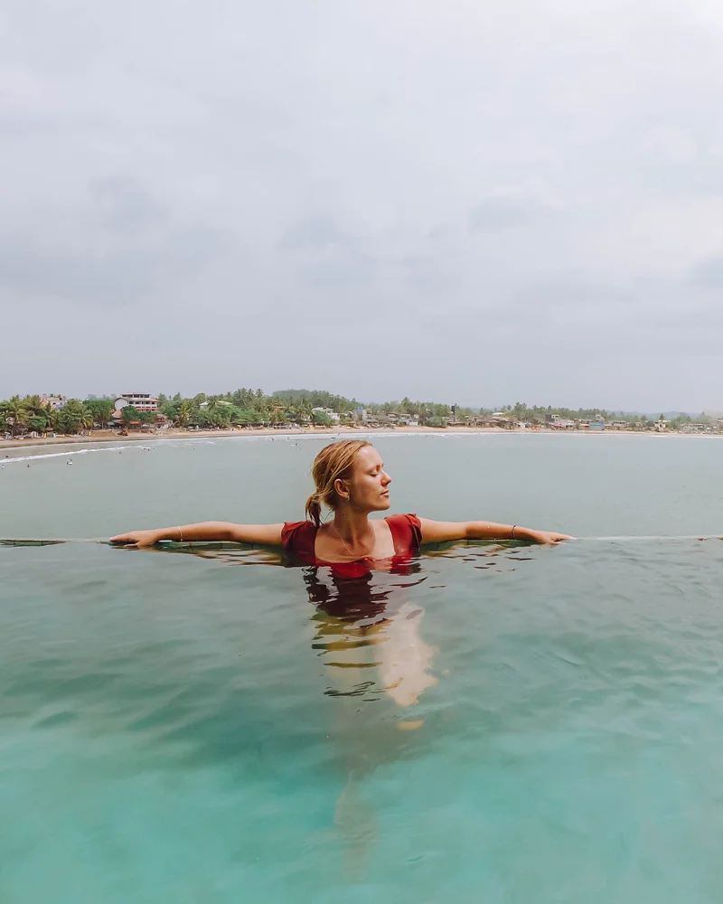 Woman in infinity pool in Sri Lanka 