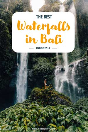 Woman standing in waterfall in Bali